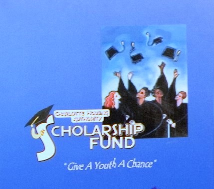 Charlotte Housing Authority Scholarship Fund with people in caps and gowns