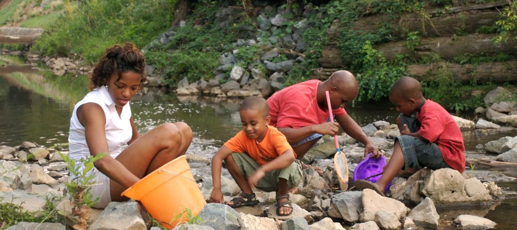 Family by creek
